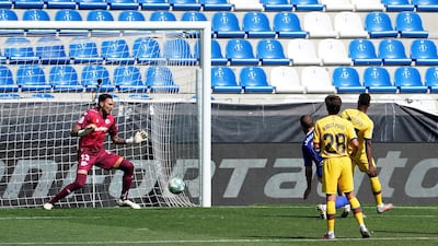 Barcelona's Ansu Fati scores the first goal against Alaves. Reuters