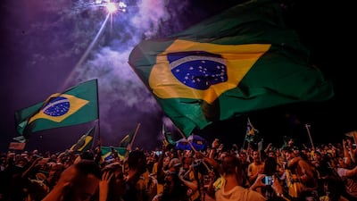 Supporters of far-right presidential candidate Jair Bolsonaro, celebrate his win in Rio de Janeiro on October 28, 2018. AFP