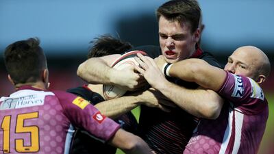 Dubai Exiles' Tom Stapley pushes forward against Doha during their West Asia Championship match at The Sevens in Dubai on January 29, 2016. Christopher Pike / The National