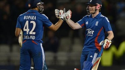 Eoin Morgan congratulates Ravi Bopara as England defeat Australia at Old Trafford