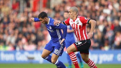 Eden Hazard of Chelsea, left, is pulled by Oriol Romeu of Southampton. Ian Walton / Getty Images