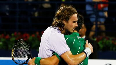 Novak Djokovic embraces Stefanos Tsitsipas after winning the final. Reuters