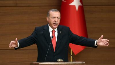 Turkish president Recep Tayyip Erdogan delivers a speech during a meeting with village chiefs at the Presidential Palace in Ankara on October 19, 2015. Adem Altan / AFP Photo