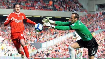 Alberto Aquilani has a shot saved by Fulham goalkeeper Mark Schwarzer during a rare outing in Liverpool colours