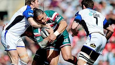 Leicester Tigers' Alesana Tuilagi is tackled by Butch James, of Bath, during the Guinness Premiership semi-final at Welford Road yesterday.