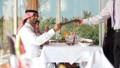 Readers debate the pros and cons of tipping at restaurants. Celia Peterson for The National