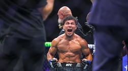 Ramazan Temirov celebrates his win after the flyweight bout against Steve Erceg at UFC Fight Night in Abu Dhabi on July 25. Victor Besa / The National