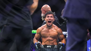 Ramazan Temirov celebrates his win after the flyweight bout against Steve Erceg at UFC Fight Night in Abu Dhabi on July 25. Victor Besa / The National