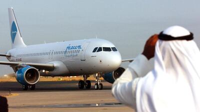 A Jazeera Airlines Airbus A-320 plane taxies towards the departure gates at Kuwait International Airport. The Boursa Kuwait-listed budget carrier said shareholders approved a dividend of 35 fils per share on Thursday. Gustavo Ferrari / AP Photo