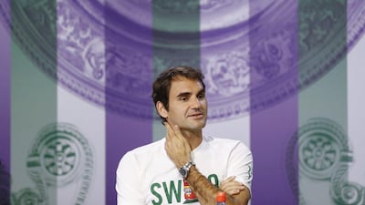 Roger Federer of Switzerland addresses media at a press conference ahead of the 2016 Wimbledon championship. Peter Klaunzer / EPA / June 25, 2016