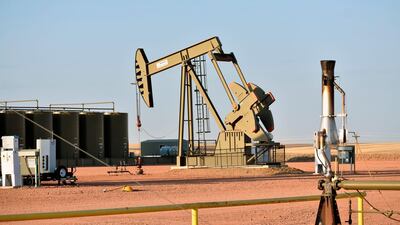 A pumpjack is seen extracting crude oil from a well on the Fort Berthold Indian Reservation. AP Photo