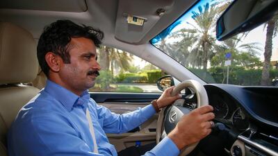 Abrar Ahmed, Careem's longest serving driver, takes 'The National' for a spin in Dubai Media City. The ride-hailing app is now to expand its services in Abu Dhabi. Chris Whiteoak / The National