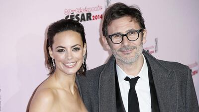 French director Michel Hazanavicius, right, and French actress Berenice Bejo, left, arrive to the ceremony held at the Chatelet Theatre. Ian Langsdon / EPA