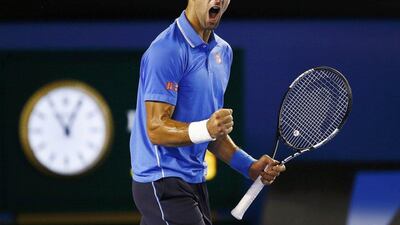 Novak Djokovic roars with delight after defeating defending champion Stanislas Wawrinka in five sets to reach the Australian Open final. Issei Kato / Reuters
