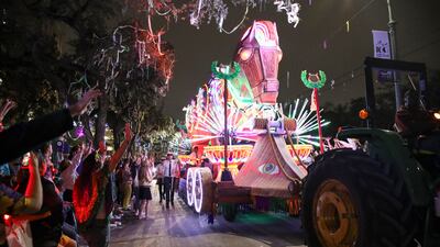 People cheer as the Krewe of Orpheus rolls through New Orleans before Mardi Gras. AP