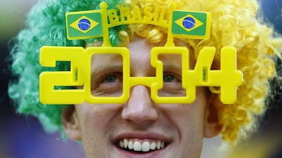 A fan looks on as he waits for the 2014 World Cup opening match between Brazil and Croatia. Reuters