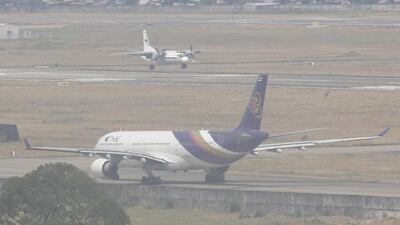 A military aircraft lands in hazy weather at the Tan Son Nhat airport in Ho Chi Minh City after its search and rescue mission. Reuters
