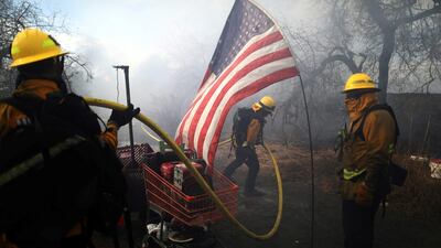 Firefighters tackle a blaze at a homeless encampment in Montebello, California, U.S. REUTERS