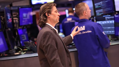 Traders work at the New York Stock Exchange on Friday. AFP