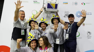Members of Bosnia and Herzegovina react after hearing their score.