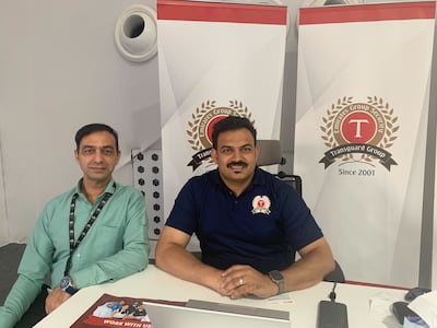 Shahid Mahmmud, a senior manager in recruitment services for the Transguard Group, right, at Al Awir amnesty centre in Dubai. Photo: Ali Al Shouk