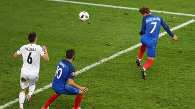 Antoine Griezmann, right, of France scores his sides first goal. Lars Baron/Getty Images
