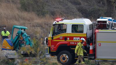 Fire and Emergency crew prepare to battle a bushfire near a house in the rural town of Canungra in the Scenic Rim region of South East Queensland, Australia. EPA