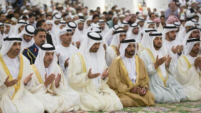 Sheikh Mohammed bin Zayed Al Nahyan, Crown Prince of Abu Dhabi and Deputy Supreme Commander of the Armed Forces, centre, attends Eid Al Fitr prayers at the Sheikh Zayed Grand Mosque. Seen here with Sheikh Saeed bin Zayed, Abu Dhabi Ruler’s Representative, left, Sheikh Hazza bin Zayed, Vice Chairman of the Abu Dhabi Executive Council, second left, Sheikh Saif bin Mohammed, third right, Sheikh Mohammed bin Butti Al Hamed, fourth right, and Sheikh Suroor bin Mohammed, right. Ryan Carter / Crown Prince Court - Abu Dhabi