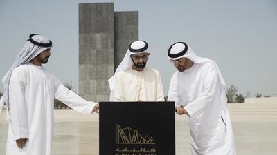 Sheikh Mohammed bin Rashid, Prime Minister and Ruler of Dubai, and Sheikh Mohammed bin Zayed, Crown Prince of Abu Dhabi and Deputy Supreme Commander of the Armed Forces, sign the guest book at Wahat Al Karama after a Cabinet meeting there on Sunday. With them is Sheikh Khalifa bin Tahnoon bin Mohammed, Director of the Martyrs’ Families’ Affairs Office of the Abu Dhabi Crown Prince Court. Ryan Carter / Crown Prince Court - Abu Dhabi