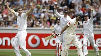 England's James Anderson, left, appeals for a catch on Australia's Mitchell Johnson, second right, who is out for no score during the first day of their fourth Ashes cricket test.