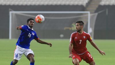 Ali Mabkhout fights for the ball with Malaysia’s Kunanlan Subramanian. Ravindranath K / The National