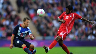 Aaron Ramsey of Great Britain kicks the ball past Rashed Eisa of UAE. Getty Images