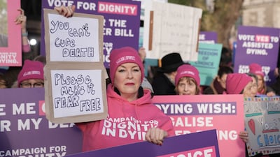 A demonstration organised by campaign group Dignity in Dying outside the Houses of Parliament. PA