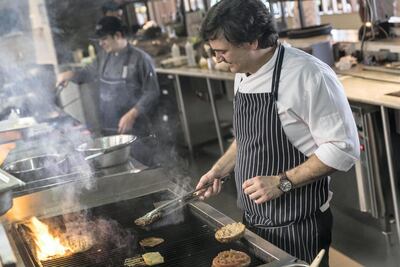 Chef Theodoro Rouvas, Head Chef at Eat Greek in the Galleria Mall prepares a Moussaka Burger. Antonie Robertson / The National