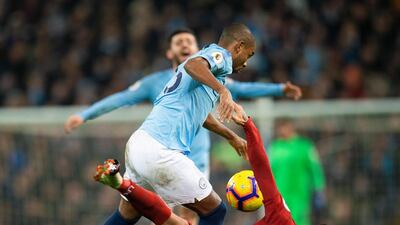Manchester City's Fernandinho (L) in action with Liverpool's Roberto Firmino (R) during the English Premier League soccer match between Manchester City and Liverpool at the Etihad Stadium in Manchester. EPA