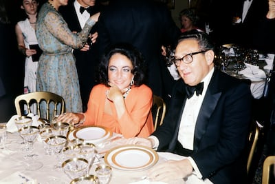 Elizabeth Taylor and secretary of state Henry Kissinger attend an Iranian Embassy dinner party on April 6, 1976 in Washington. Getty Images