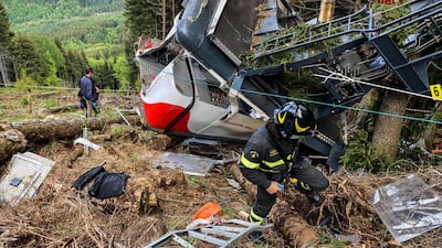 Rescuers search the area where the cable car crashed in the resort town of Stresa on the shores of Lake Maggiore in the Piedmont region. AFP