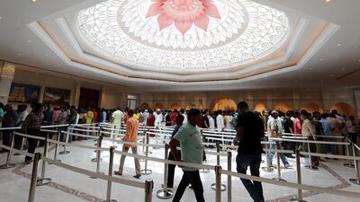 Sunlight streams through the lotus motif in the central prayer hall
