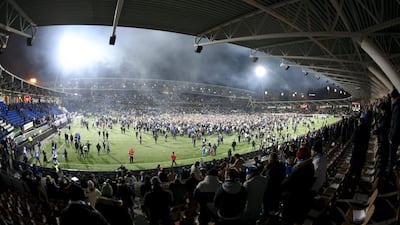 Finland players and fans players celebrate on the pitch following their Euro 2020 qualifying victory over Liechtenstein on Friday November 15, which meant they sealed a spot in a major finals for the first time. AFP