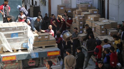 People unload medical aid from a lorry near Kamal Adwan Hospital in the northern Gaza Strip. Reuters