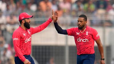 England's Chris Jordan, right, celebrates with teammate Moeen Ali after the dismissal of Bangladesh opener Litton Das. AP