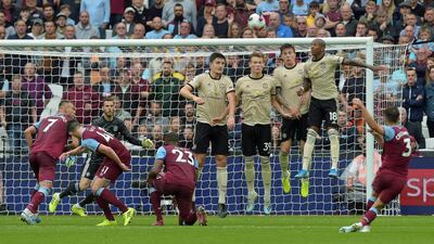 West Ham's Aaron Cresswell curls home a stunning free-kick to score his side's second goal against Manchester United at the London Stadium on Sunday. EPA