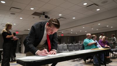 A man takes part in the Republican presidential caucus, in West Des Moines, Iowa. Reuters
