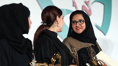 From left, Laila Al Muhairi, Reem Osman and Maryam Al Hashemi flash their winning smiles after being honoured at the Emirates Women Awards in Dubai. Satish Kumar / The National