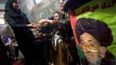Afghan women celebrate Hamid Karzai's victory over Abdullah Abdullah in Presidential election, in a campaign centre in Herat November 2, 2009.