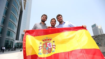 Local Spanish soccer fans Nicholas Calonje, Carlos Sistiaga and Lucas Aylagas are all ready to cheer their side along. Satish Kumar / The National