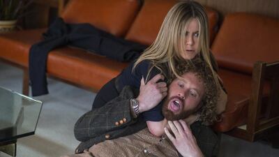 This image released by Paramount Pictures shows Jennifer Aniston and T.J. Miller in a scene from "Office Christmas Party." (Glen Wilson/Paramount Pictures via AP)