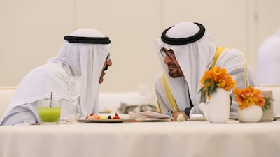 Sheikh Mohamed speaks to Sheikh Meshal over lunch at Qasr Al Watan. Abdulla Al Neyadi / UAE Presidential Court