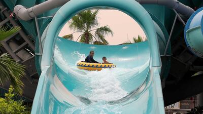 People riding water slides at the Laguna Waterpark in La Mer in Dubai. Pawan Singh / The National