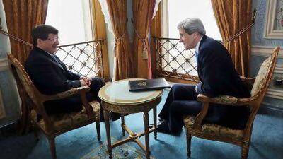 US secretary of state John Kerry (right) and Turkey's foreign minister Ahmet Davutoglu chat before their official meeting in Istanbul on April 7.